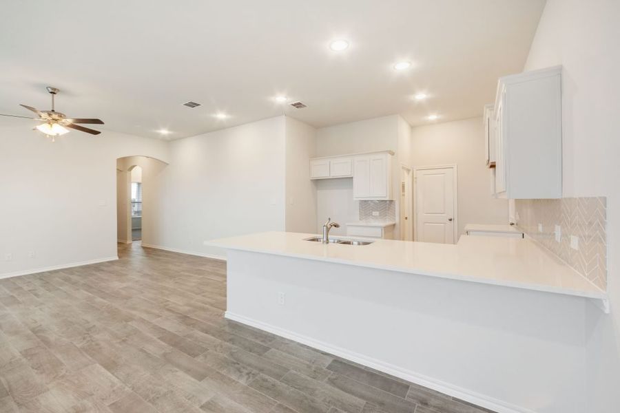 Representative exterior photo of a completed home built from the Joliet by Impression Homes in Heartland, Heartland, TX (Image 9).