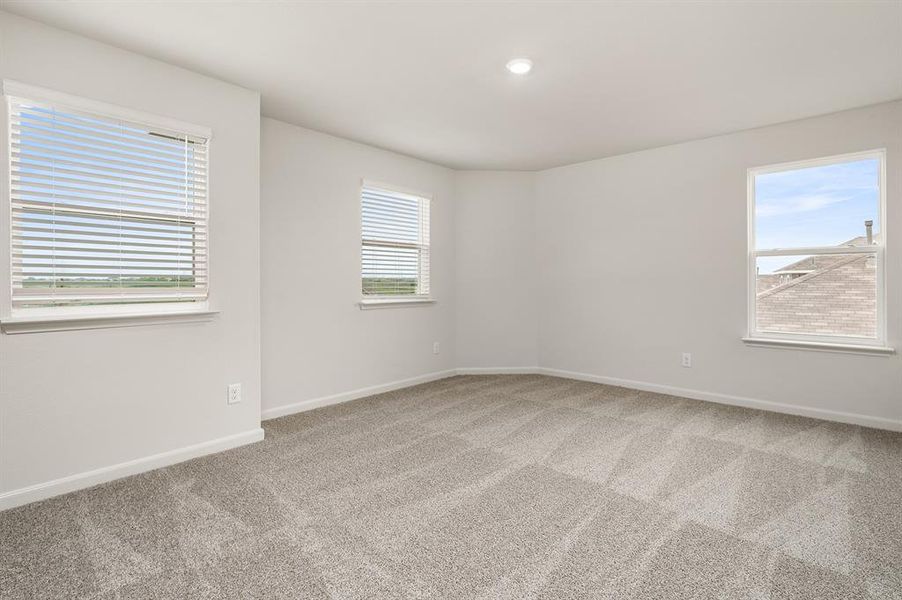 Spare room with light colored carpet, healthy amount of natural light, and recessed lighting