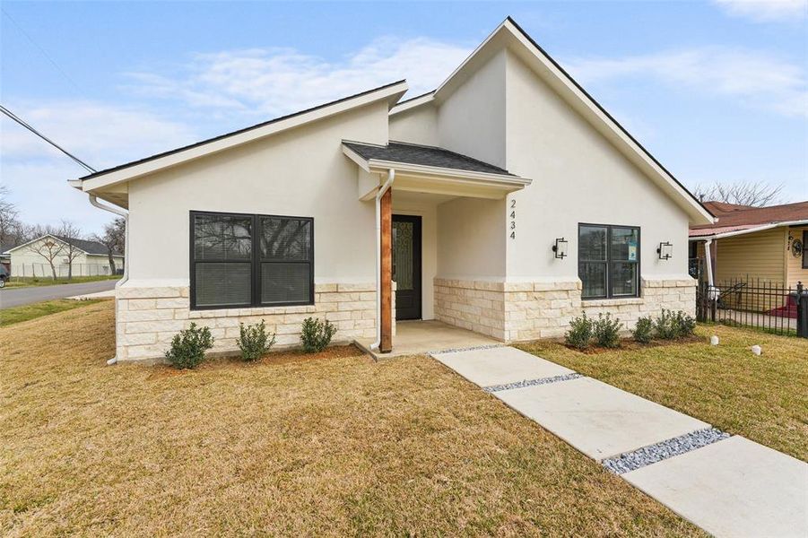 Front exterior of a new home in , Dallas, TX, highlighting curb appeal (Image 25).