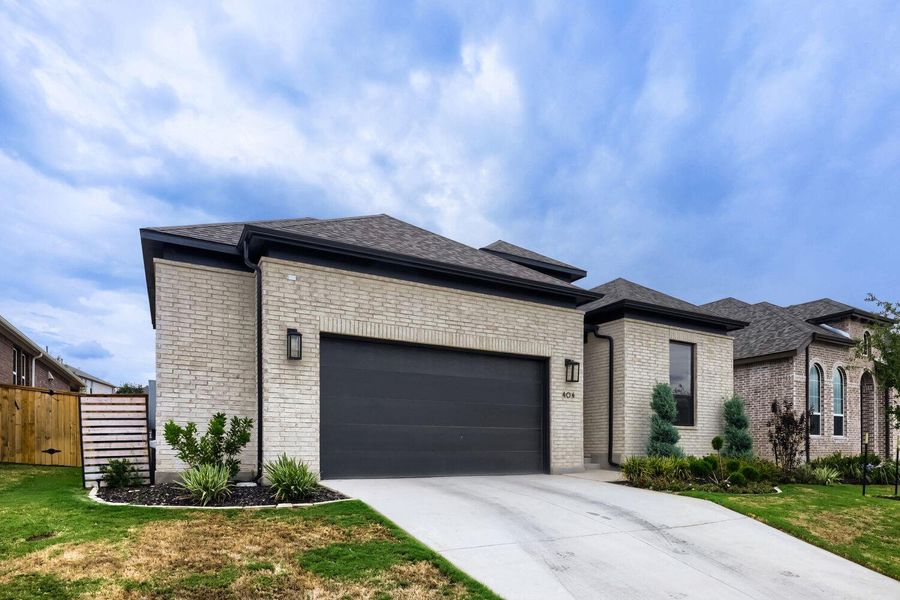 Front exterior of a new home in 6 Creeks at Waterridge, Kyle, TX, highlighting curb appeal (Image 2).