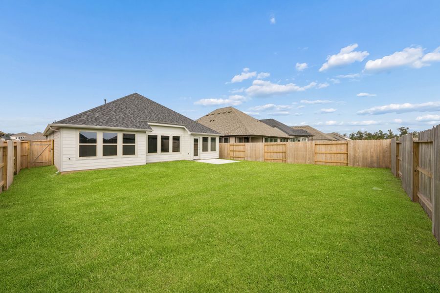 Exterior details and patio area of a home in Riviera Pines, Huffman (Image 18).
