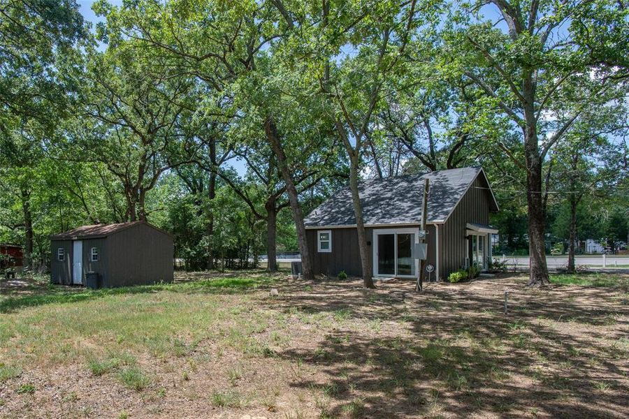 Front exterior of a new home in , Log Cabin, TX, highlighting curb appeal (Image 24).