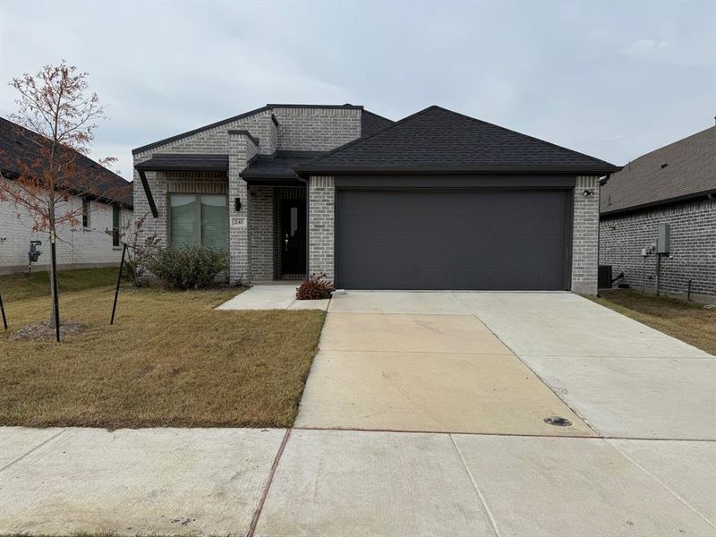 Front exterior of a new home in , Lavon, TX, highlighting curb appeal (Image 15).
