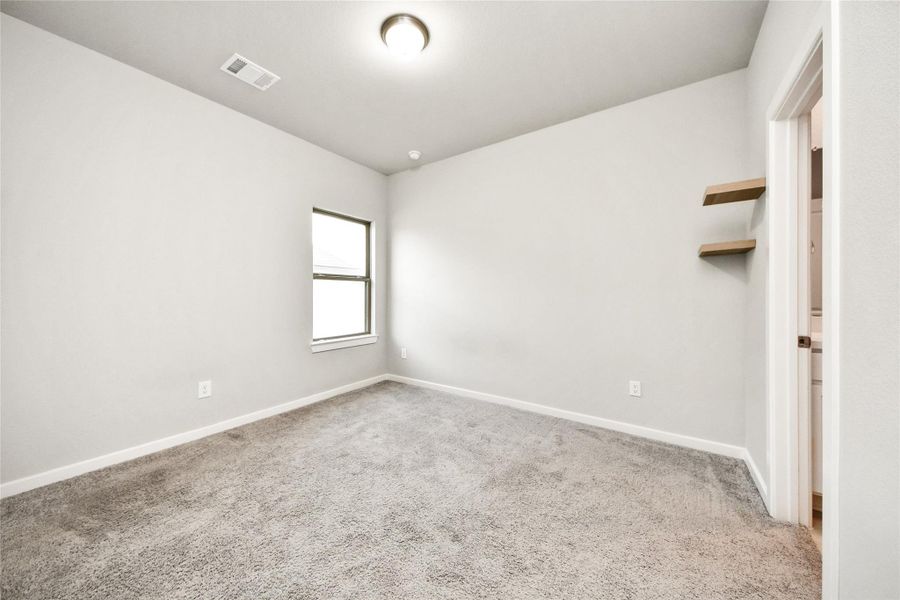 Bright secondary bedroom with clean lines, updated finishes, and versatile space to fit a variety of needs.