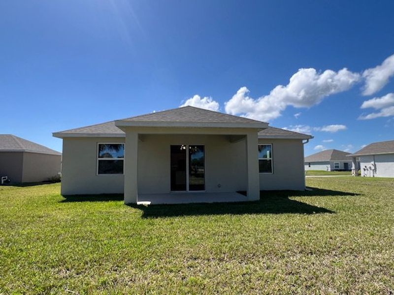 Exterior details and patio area of a home in Lakes At St Sebastian, Micco (Image 20).