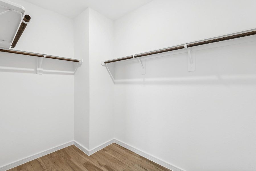 Walk-in closet in the primary suite (*Photo not of actual home and used for illustration purposes only.)