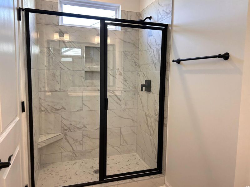 Full bath with a shower stall