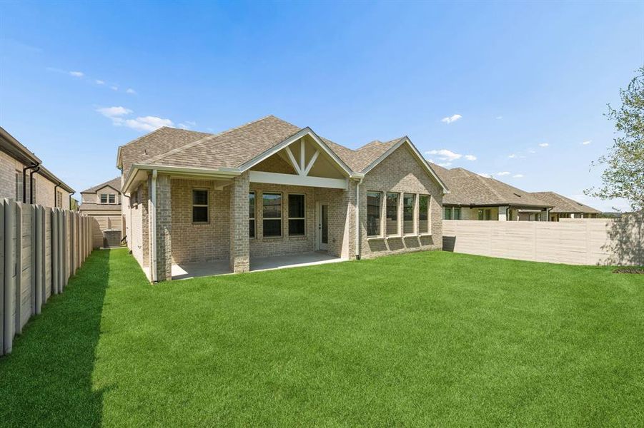 Exterior details and patio area of a home in Painted Tree Woodland West, McKinney (Image 3).