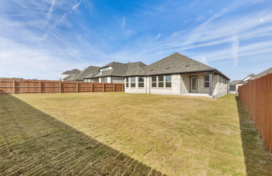 Exterior details and patio area of a home in Saddleback at Santa Rita Ranch, Liberty Hill (Image 28).