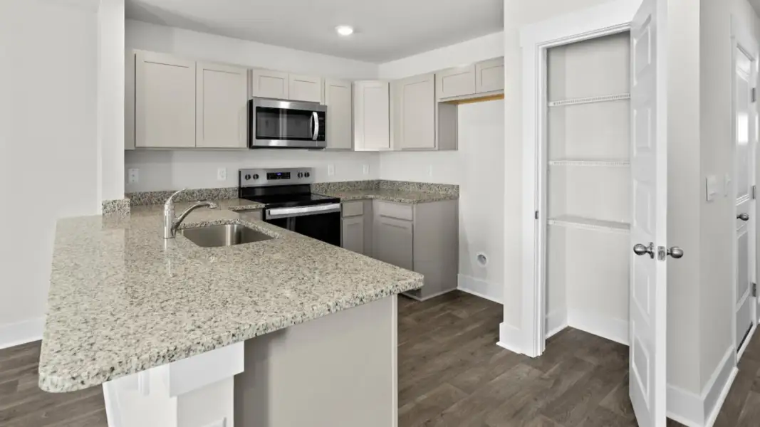 Furnished interior view inside a new home in The Townes at Cedar Hill Landing, Navassa (Image 8).