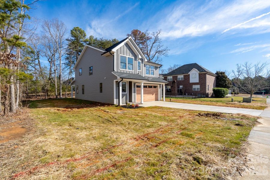 Front exterior of a new home in , Locust, NC, highlighting curb appeal (Image 20).
