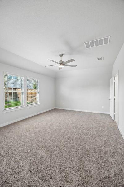 Primary Suite in the Oscar home plan by Trophy Signature Homes – REPRESENTATIVE PHOTO