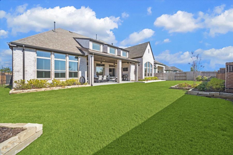 Front exterior of a new home in Elyson, Katy, TX, highlighting curb appeal (Image 21).