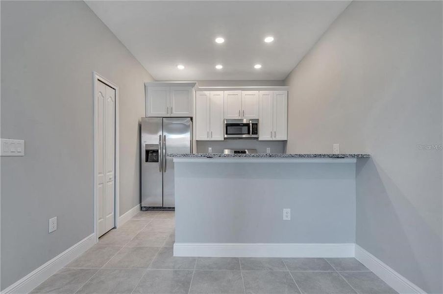 Furnished interior view inside a new home in , Kissimmee (Image 6).