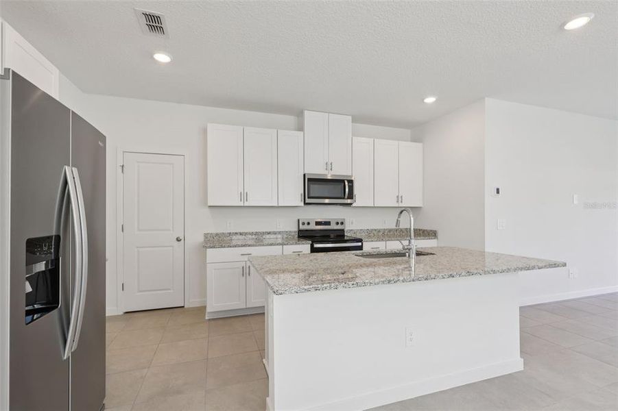 Furnished interior view inside a new home in Flagler Village - Classic Series, Palm Coast (Image 6).