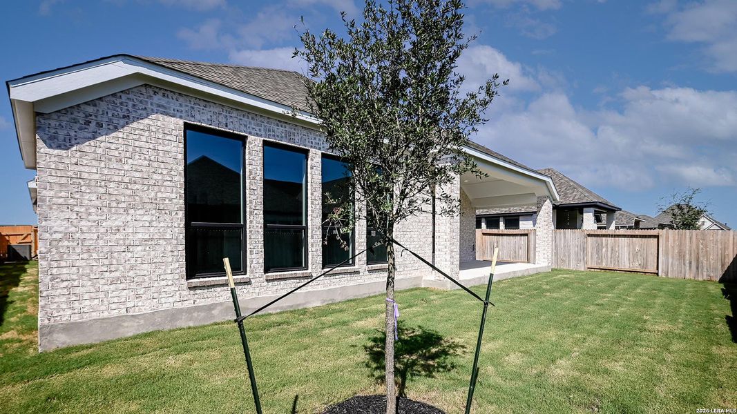 Exterior details and patio area of a home in Meadows of Mill Creek, Seguin (Image 22).