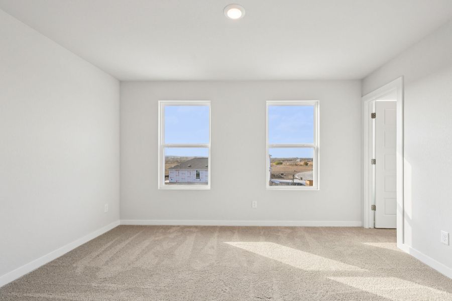 A room with a window and a door.