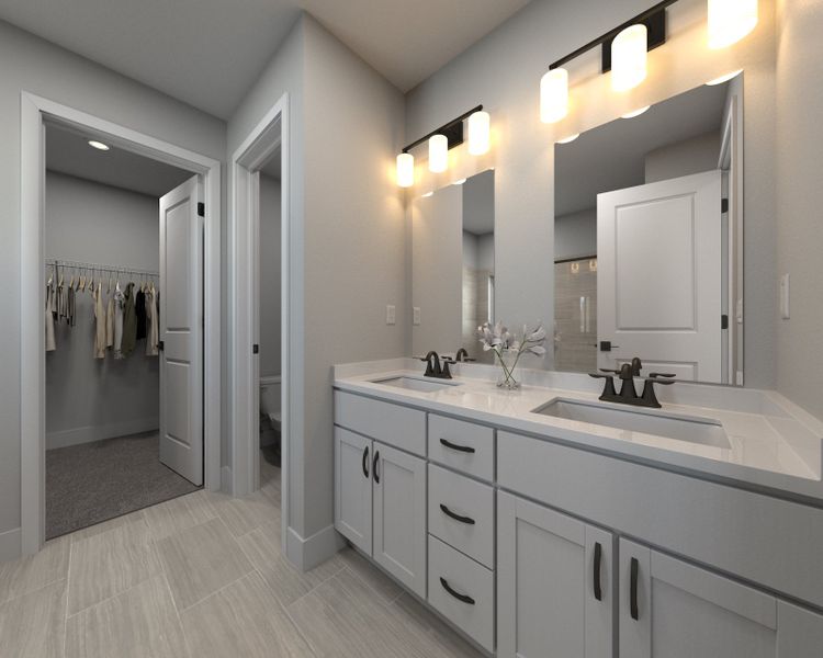 The primary bathroom offers dual vanity sinks and a walk-in shower. The primary bathroom offers dual vanity sinks and a walk-in shower.