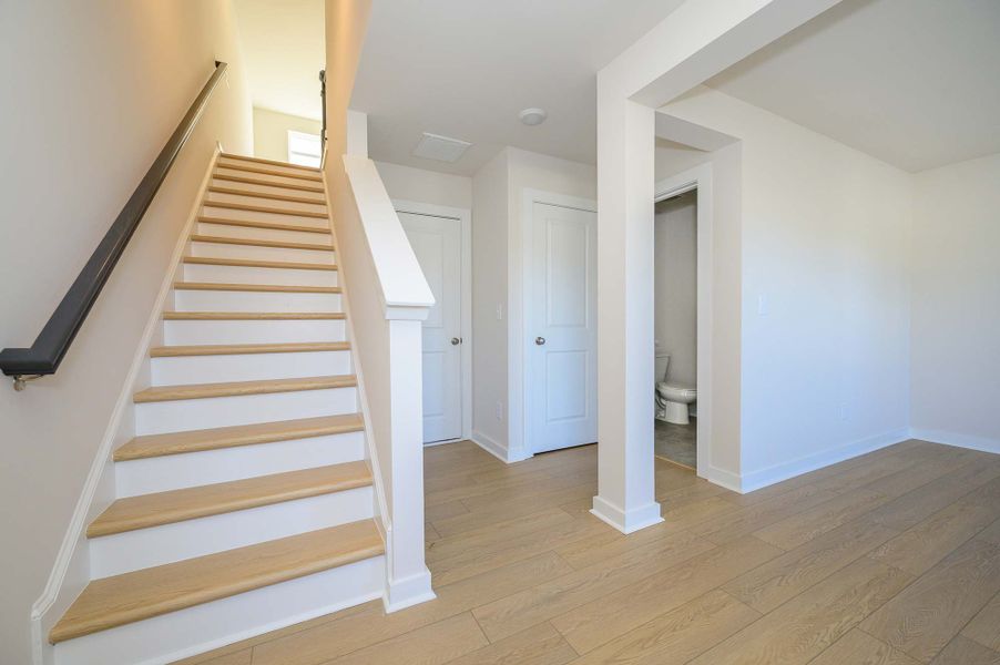 Representative unfurnished interior of a home built from the The Finney by David Weekley Homes in Central Living at Craig, Charlotte (Image 6).