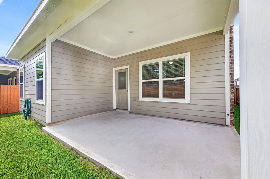 Exterior details and patio area of a home in Mill Creek Trails, Magnolia (Image 4).