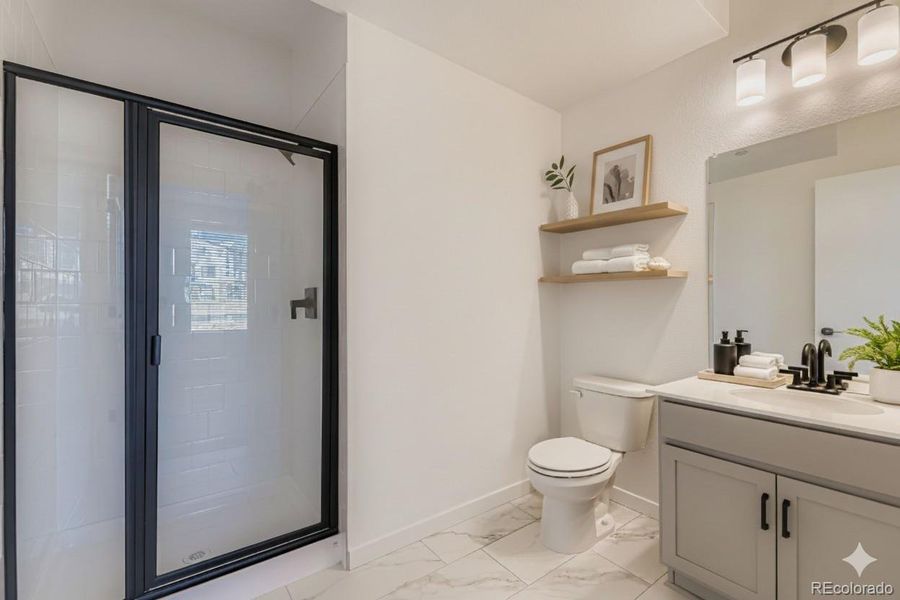 Bathroom in bedroom 3. Staged.