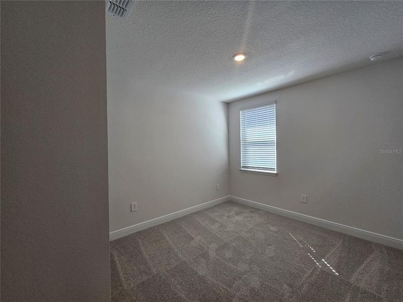 Spacious, unfurnished interior of a new home in The Reserve at Hammock Oaks - Signature Series, Lady Lake (Image 29).