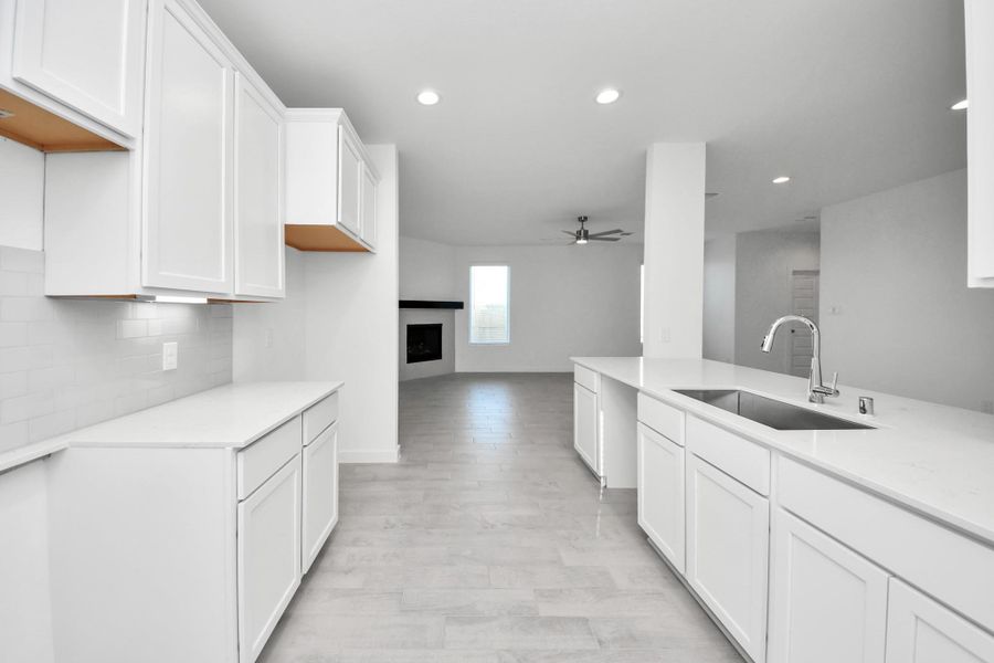 This generously spacious kitchen is a dream realized! Sample photo of completed home with similar floor plan. Actual colors and selections may vary.
