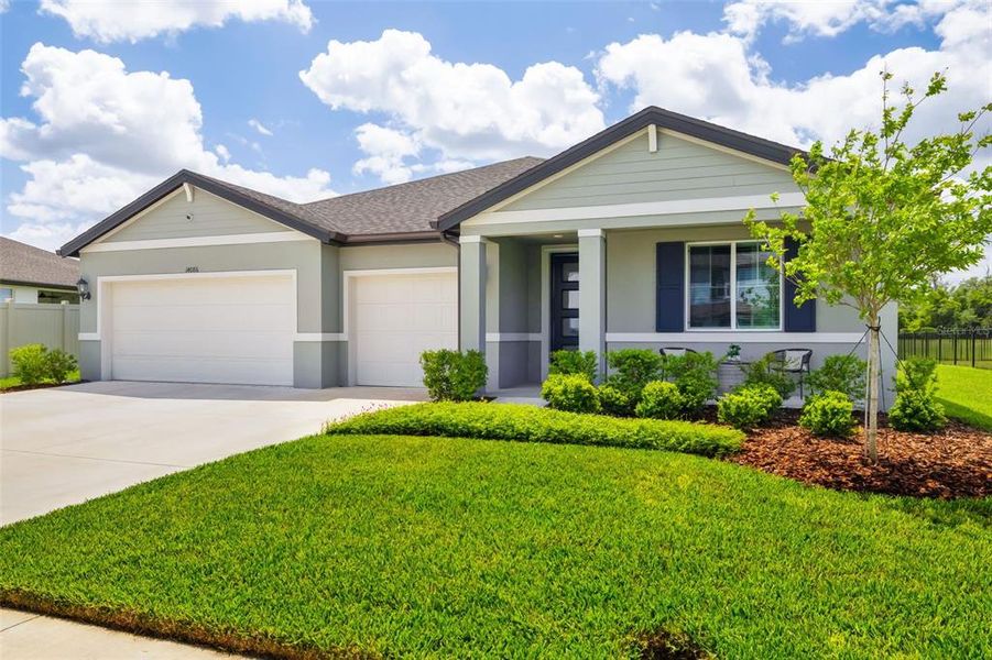 Front exterior of a new home in , Parrish, FL, highlighting curb appeal (Image 22).