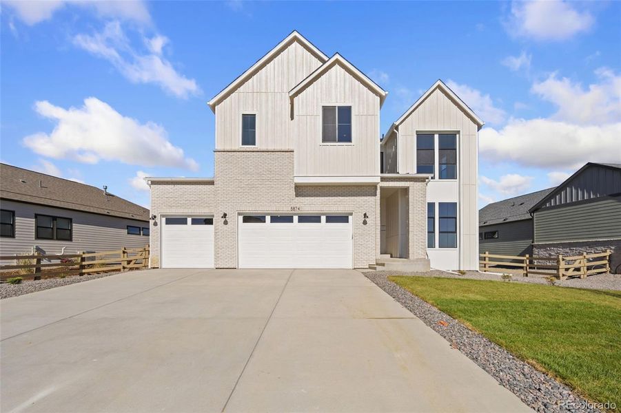 Front exterior of a new home in Kitchel Lake at Serratoga Falls, Timnath, CO, highlighting curb appeal (Image 1).