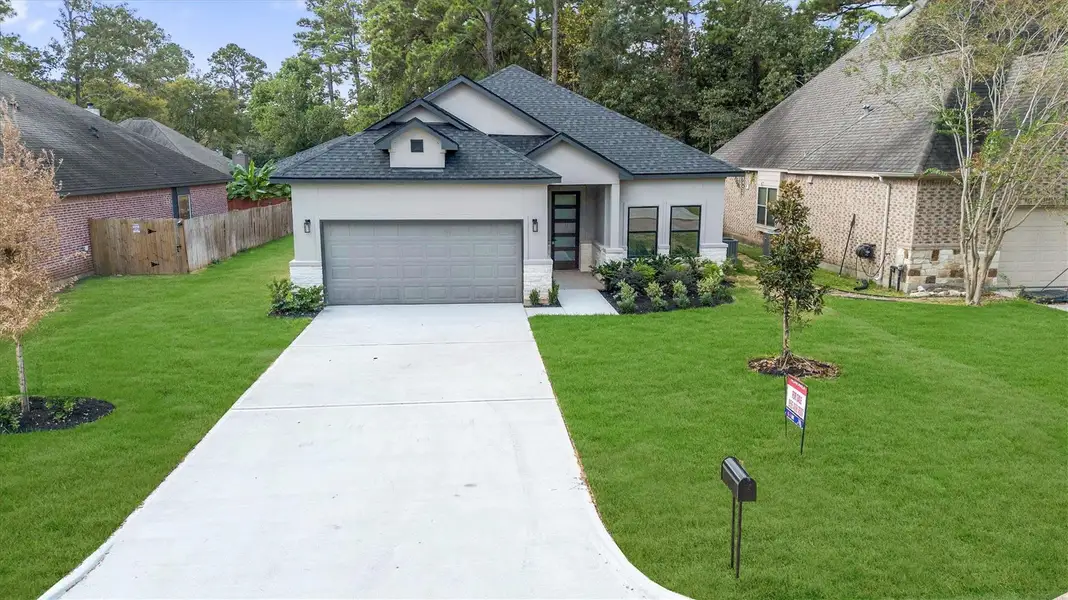 Front exterior of a new home in , Montgomery, TX, highlighting curb appeal (Image 2). Front exterior of a new home in , Montgomery, TX, highlighting curb appeal (Image 2).