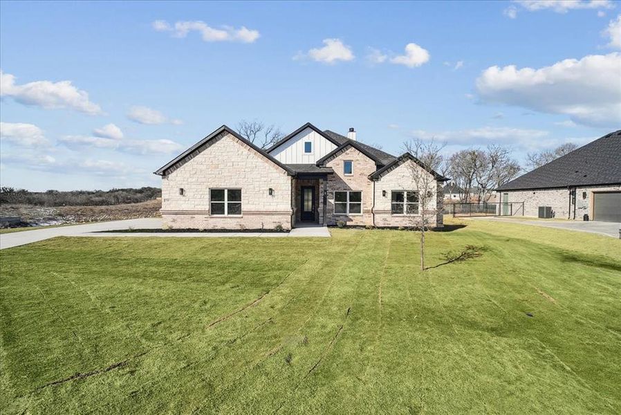 Front exterior of a new home in , Azle, TX, highlighting curb appeal (Image 1). Front exterior of a new home in , Azle, TX, highlighting curb appeal (Image 1).
