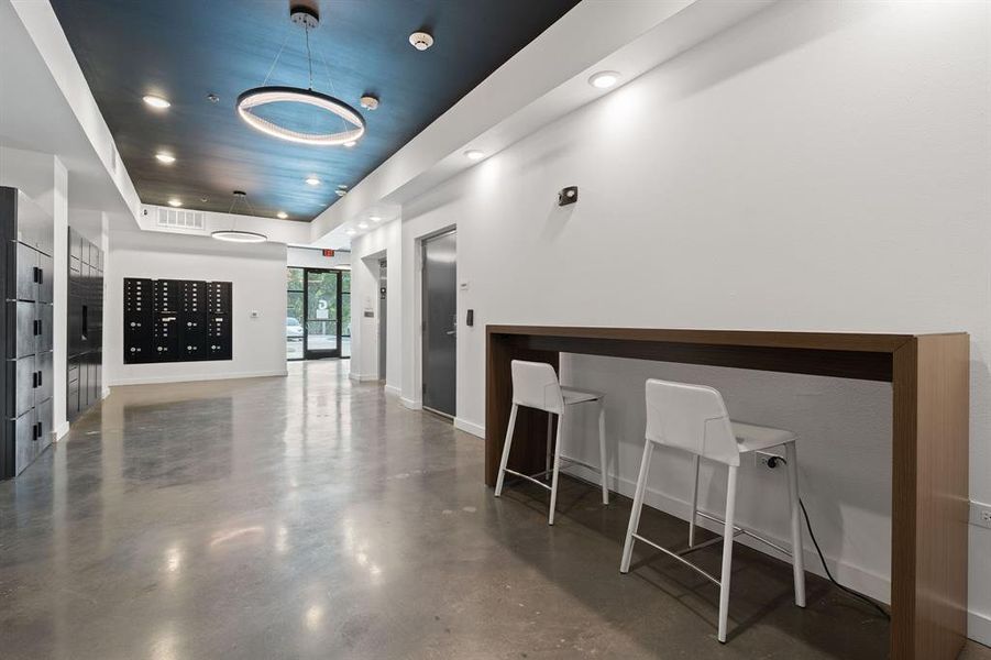 Modern lobby with Amazon lockers and secure package pickup.