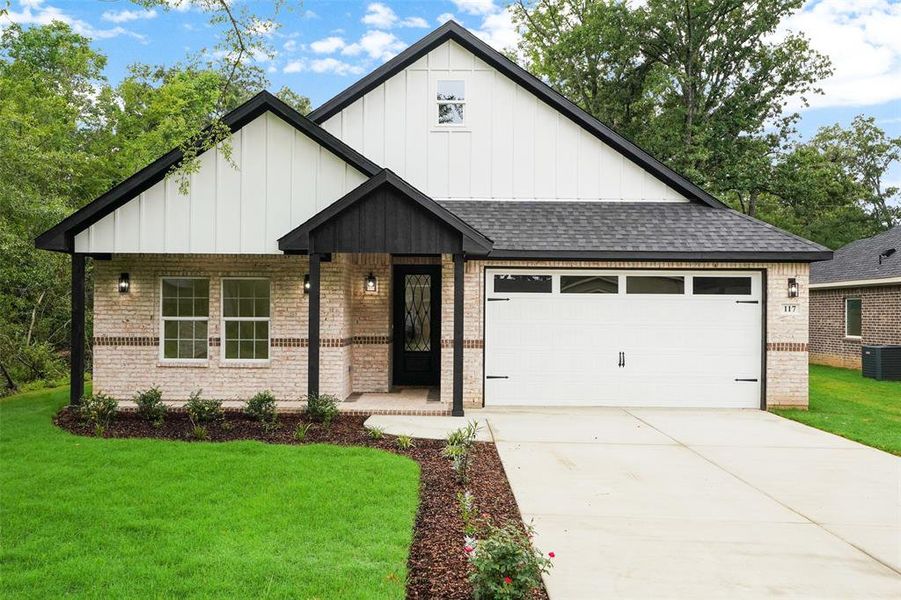 Light brick exterior with white board-and-batten gables Light brick exterior with white board-and-batten gables