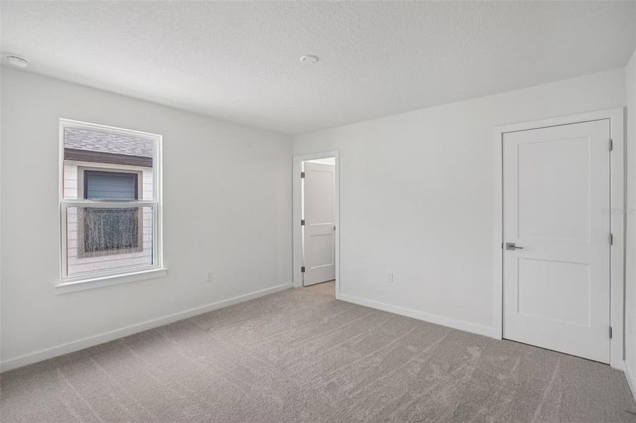 Spacious, unfurnished interior of a new home in Grasslands West, Lakeland (Image 15).