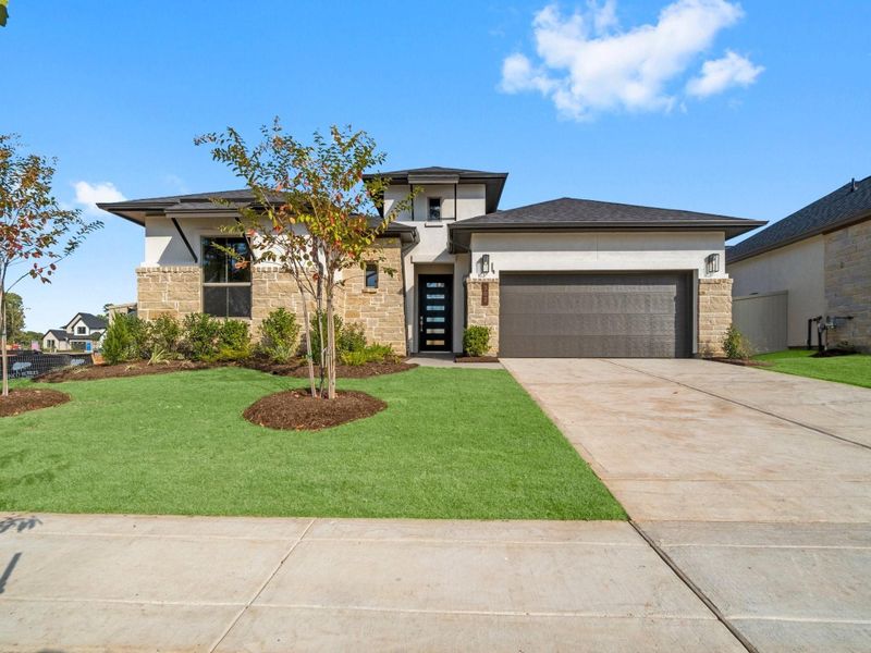 Front exterior of a new home in Audubon 60’s, Magnolia, TX, highlighting curb appeal (Image 2). Front exterior of a new home in Audubon 60’s, Magnolia, TX, highlighting curb appeal (Image 2).