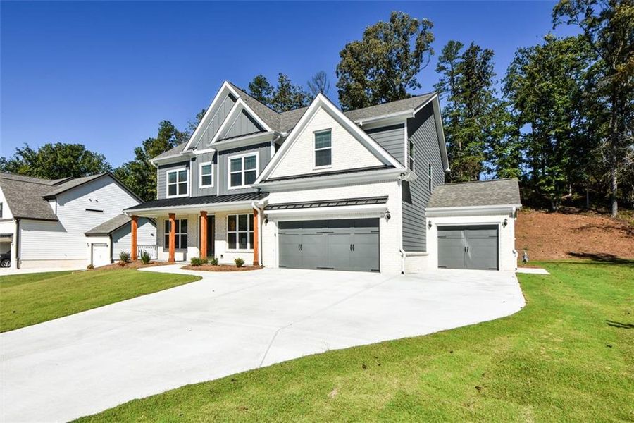 Front exterior of a new home in , Cumming, GA, highlighting curb appeal (Image 2). Front exterior of a new home in , Cumming, GA, highlighting curb appeal (Image 2).