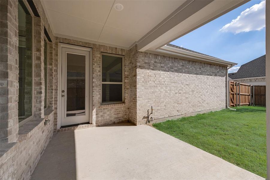 Exterior details and patio area of a home in Arbors at Legacy Hills, Celina (Image 18).