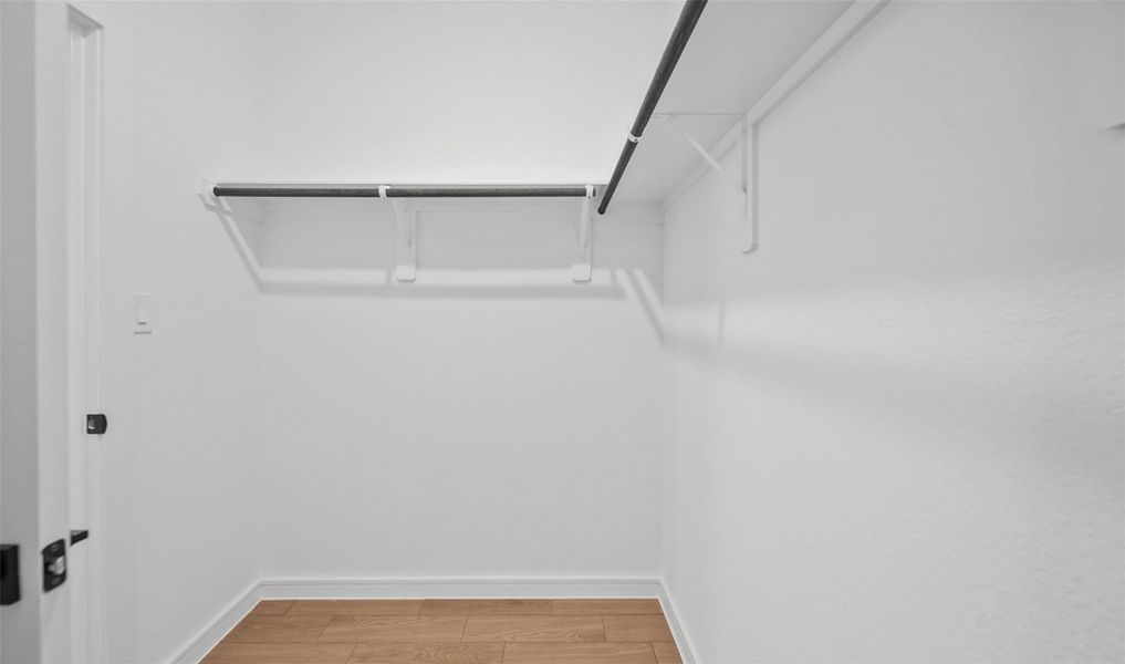 Primary walk-in closet (*Photo not of actual home and used for illustration purposes only.)