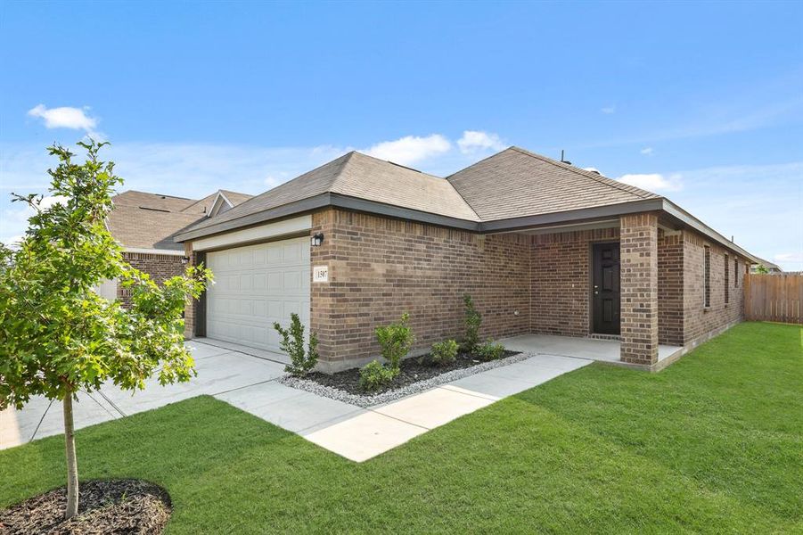 Front exterior of a new home in Christian Meadows, Ennis, TX, highlighting curb appeal (Image 2). Front exterior of a new home in Christian Meadows, Ennis, TX, highlighting curb appeal (Image 2).