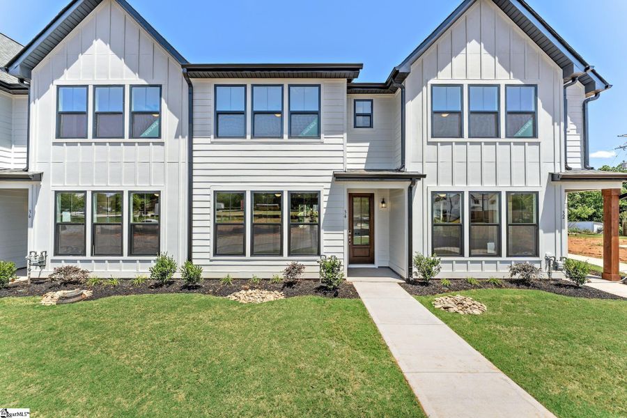 Front exterior of a new home in Renaissance Place, Greenville, SC, highlighting curb appeal (Image 2).