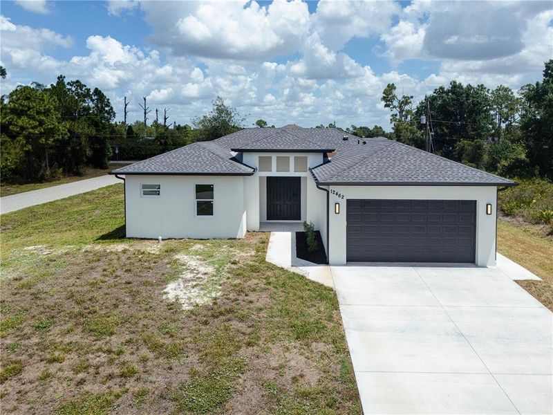 Front exterior of a new home in , Port Charlotte, FL, highlighting curb appeal (Image 29). Front exterior of a new home in , Port Charlotte, FL, highlighting curb appeal (Image 29).