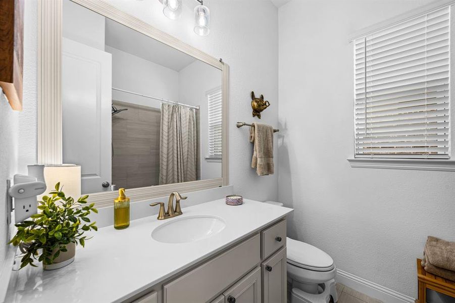 Full bath with vanity and a tub-shower combination. Full bath with vanity and a tub-shower combination.