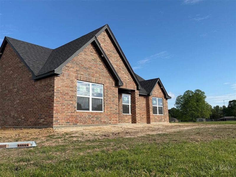 Exterior details and patio area of a home in , Powderly (Image 6).