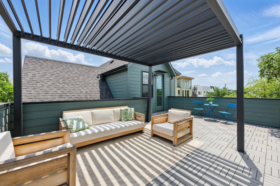 Wooden deck featuring a patio area, a pergola, and an outdoor hangout area Wooden deck featuring a patio area, a pergola, and an outdoor hangout area