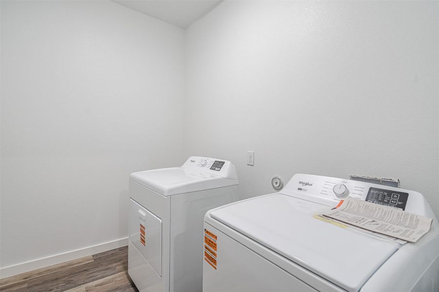 Functional laundry appliances stand ready in a well-appointed utility area. Functional laundry appliances stand ready in a well-appointed utility area.