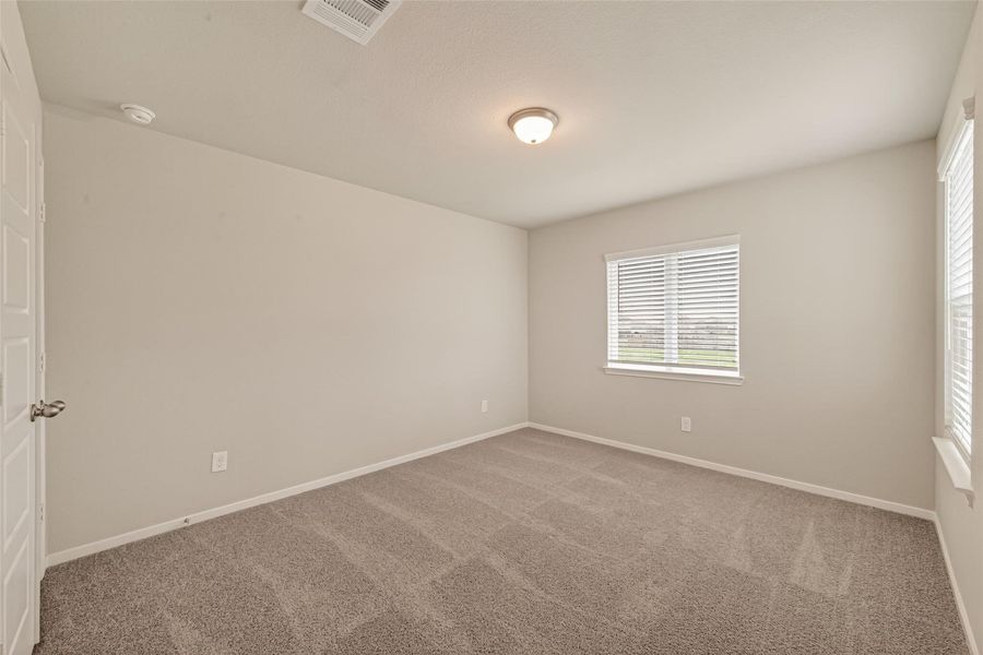 Spacious, unfurnished interior of a new home in Sunterra, Katy (Image 26).