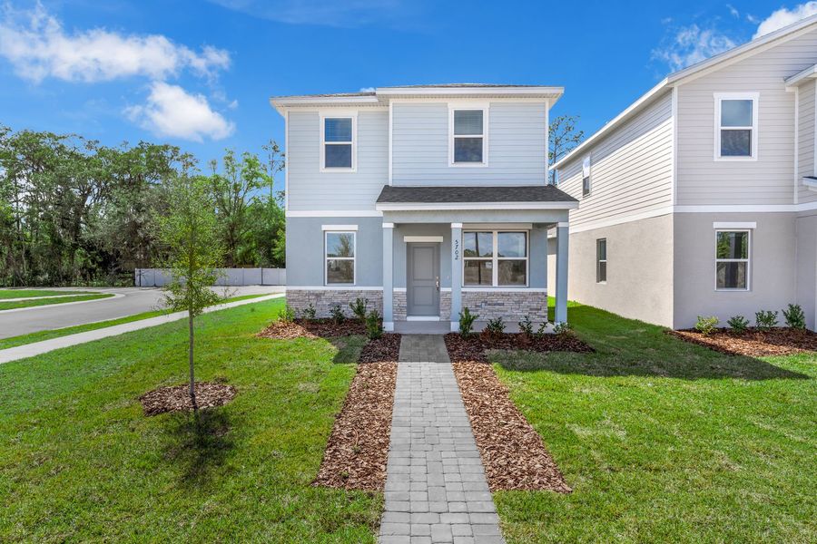 Front exterior of a new home in Brack Ranch, St. Cloud, FL, highlighting curb appeal (Image 22). Front exterior of a new home in Brack Ranch, St. Cloud, FL, highlighting curb appeal (Image 22).