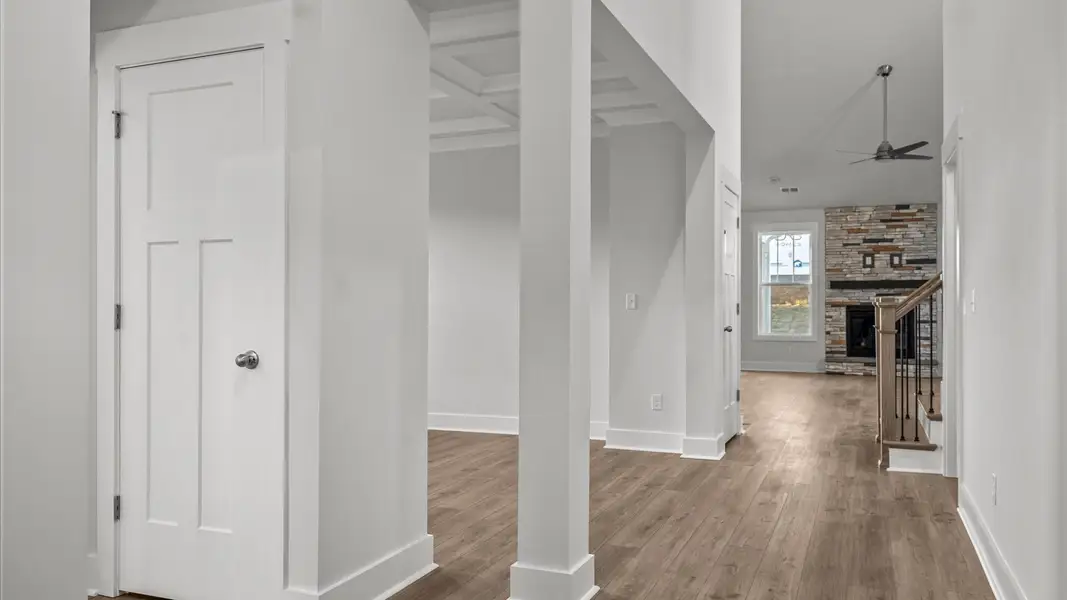 First-class entryway featuring hardwood floors and accomplished architectural style