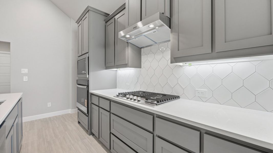 Representative furnished interior of a home built from the BASSWOOD by D.R. Horton in Treeline, Justin (Image 12).