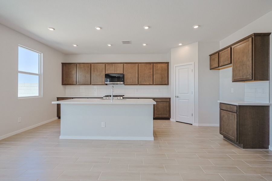 A kitchen with wooden cabinets. A kitchen with wooden cabinets.
